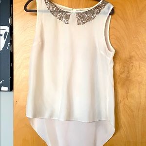 Cream sleeveless blouse with gold detail